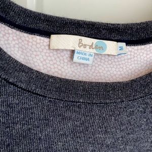 Super fun Boden sweater that has open fabric back